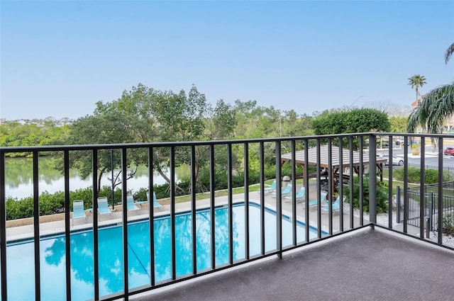 balcony featuring a water view