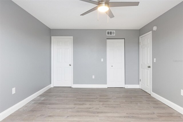 unfurnished bedroom featuring ceiling fan and light hardwood / wood-style floors