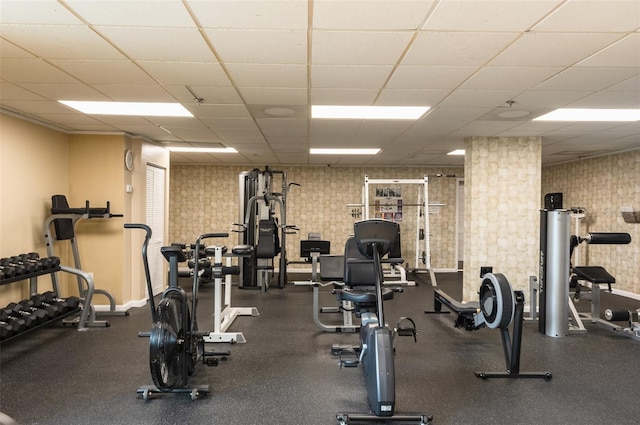 workout area with a paneled ceiling