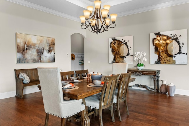 dining room featuring ornamental molding, a chandelier, and dark hardwood / wood-style floors