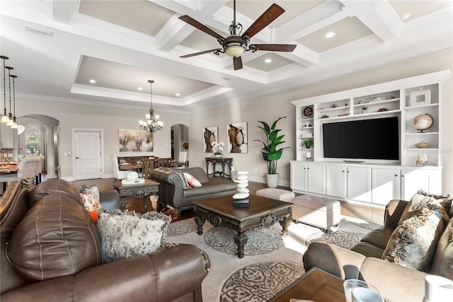 living room with ceiling fan with notable chandelier, beam ceiling, crown molding, and coffered ceiling