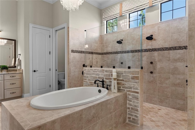 full bathroom with vanity, toilet, ornamental molding, a chandelier, and separate shower and tub