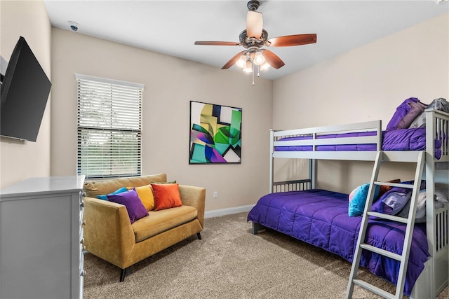 bedroom featuring ceiling fan and carpet