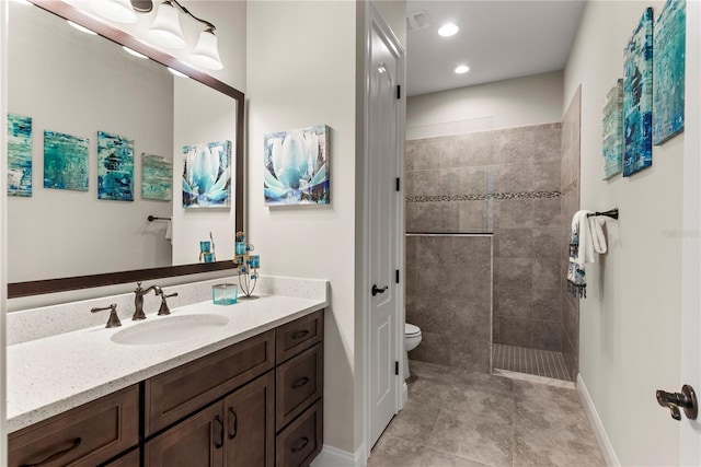 bathroom with toilet, a shower, tile patterned flooring, and vanity