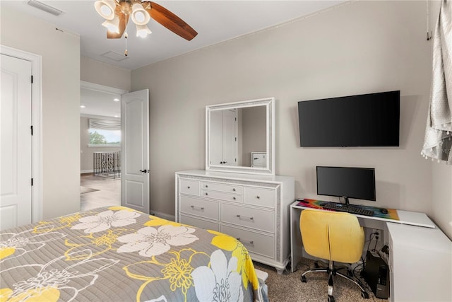 bedroom featuring ceiling fan and light colored carpet