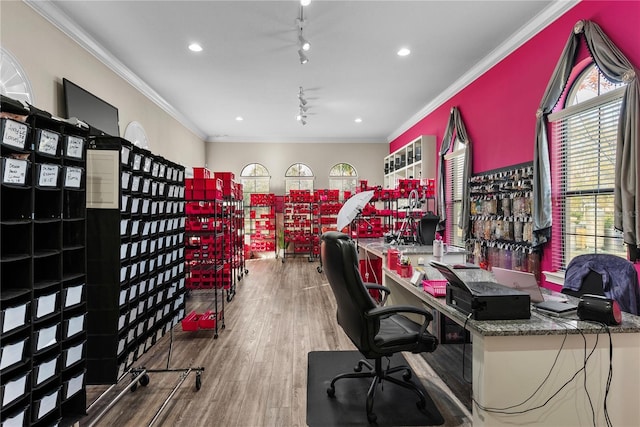 office area featuring hardwood / wood-style flooring, ornamental molding, and rail lighting