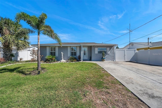 single story home with a front lawn