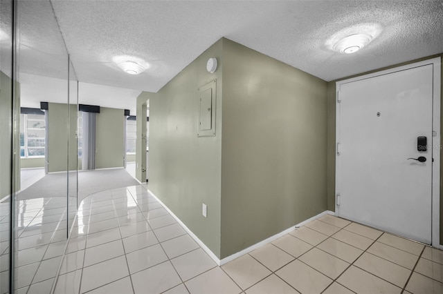 tiled entryway featuring electric panel