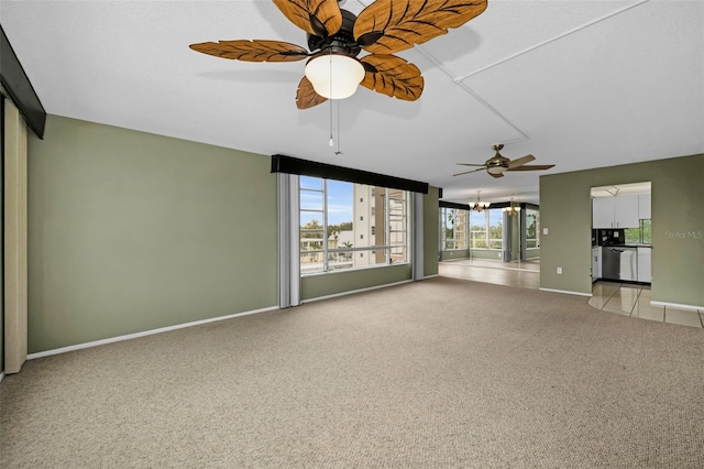 interior space with light colored carpet and ceiling fan with notable chandelier