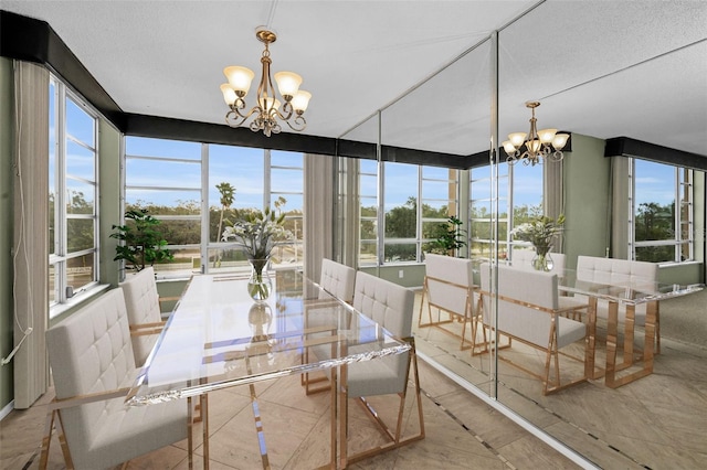 sunroom featuring an inviting chandelier