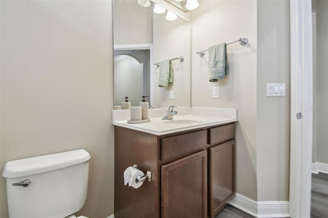 bathroom with vanity and toilet