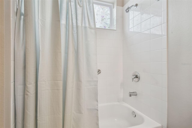 bathroom featuring shower / bath combo with shower curtain