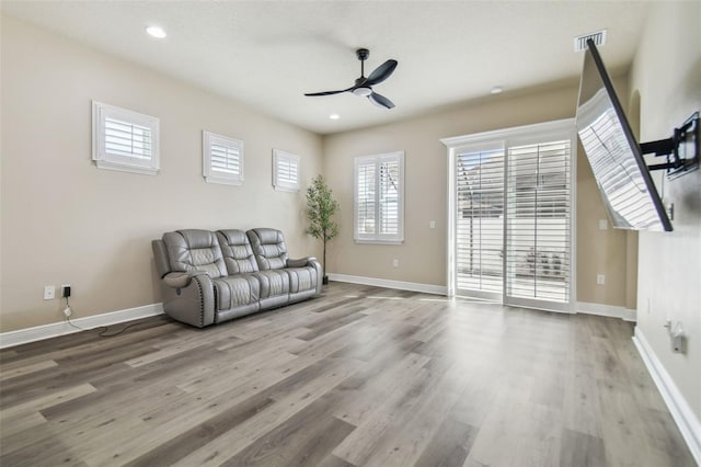 unfurnished room with ceiling fan and wood-type flooring