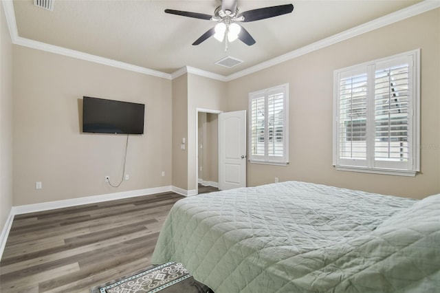 bedroom with ceiling fan, crown molding, and wood-type flooring