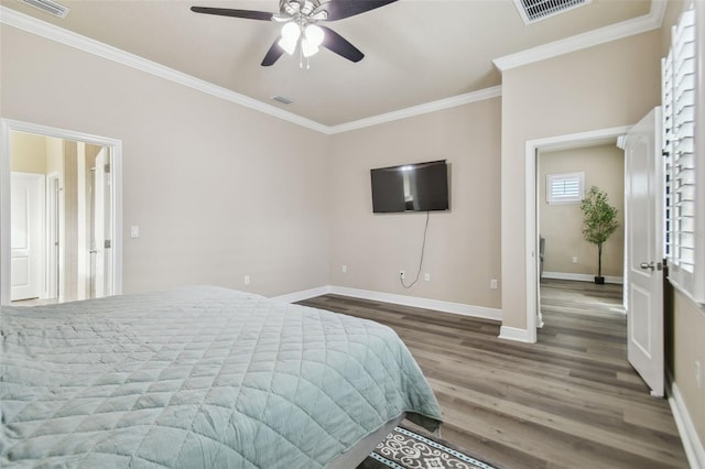 bedroom with ceiling fan, crown molding, and dark wood-type flooring