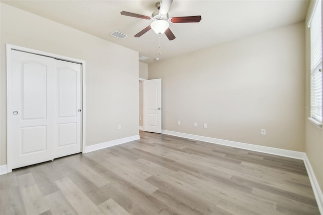 unfurnished bedroom featuring a closet, ceiling fan, and light hardwood / wood-style floors