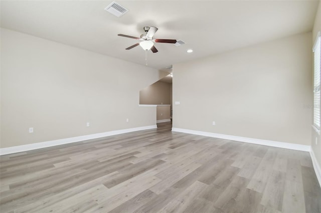 spare room with ceiling fan and light hardwood / wood-style flooring