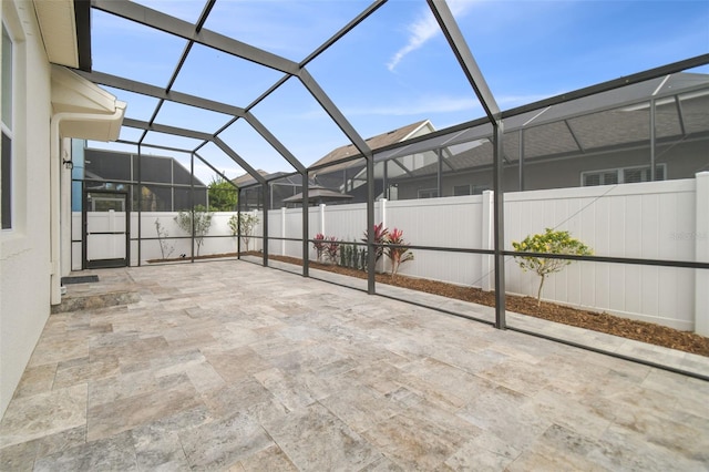 view of patio / terrace featuring glass enclosure