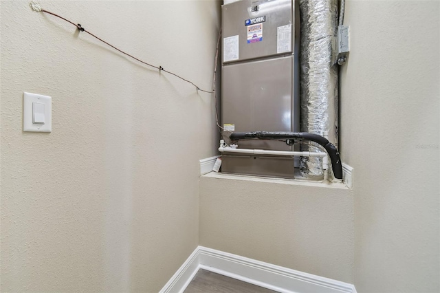 interior space with wood finished floors and baseboards