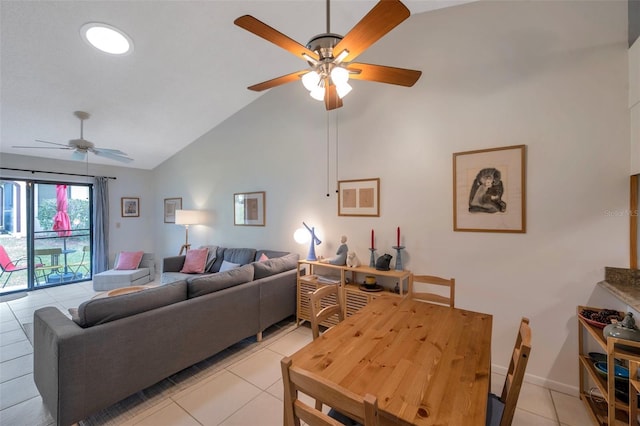 tiled living room featuring ceiling fan and vaulted ceiling