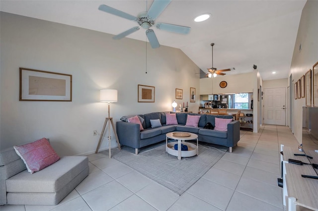 living room with vaulted ceiling and light tile patterned floors