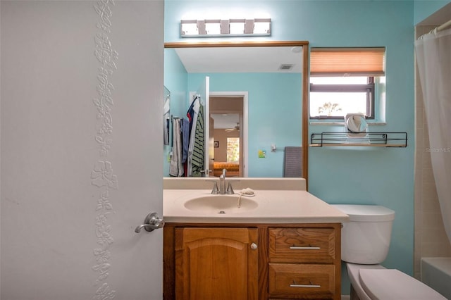 bathroom featuring vanity and toilet