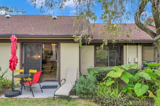 back of property with a patio and central air condition unit