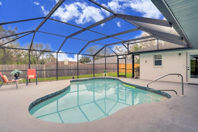 view of swimming pool with a fenced in pool, a patio, a fenced backyard, and glass enclosure