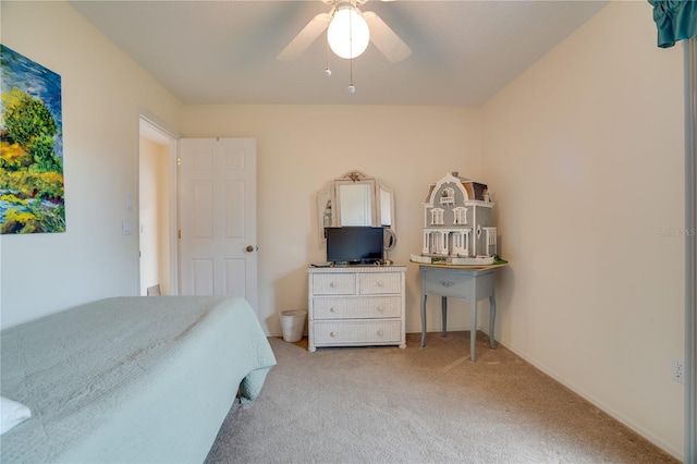 bedroom with light carpet, baseboards, and ceiling fan