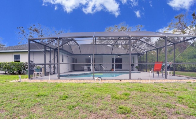 4553 31st Ct E, Bradenton, FL 34203 - rear view of house with a patio area, a yard, ceiling fan, an outdoor pool, and a lanai