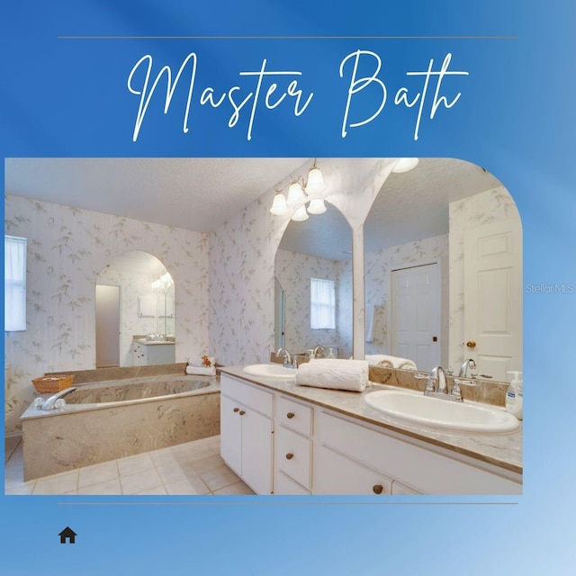 4553 31st Ct E, Bradenton, FL 34203 - full bathroom featuring a bath, double vanity, wallpapered walls, tile patterned floors, and a textured ceiling