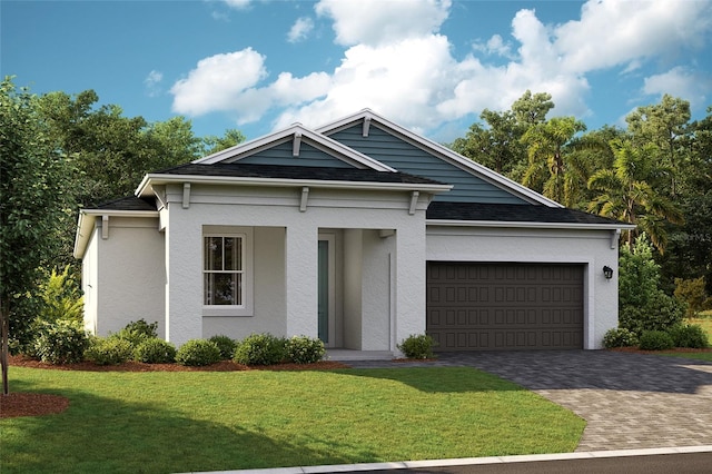 view of front of house with a garage and a front lawn