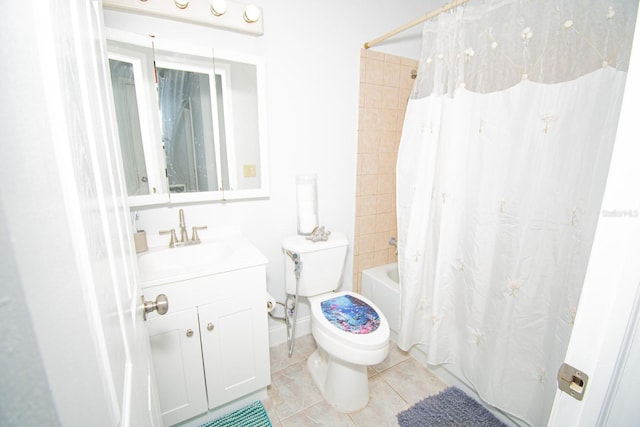 full bathroom featuring toilet, vanity, tile patterned floors, and shower / bath combination with curtain