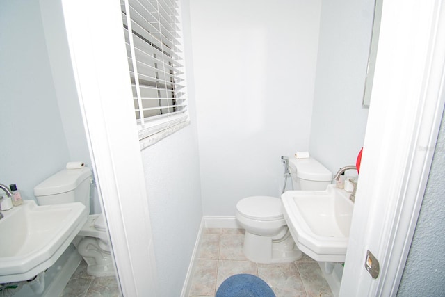 bathroom with toilet and sink