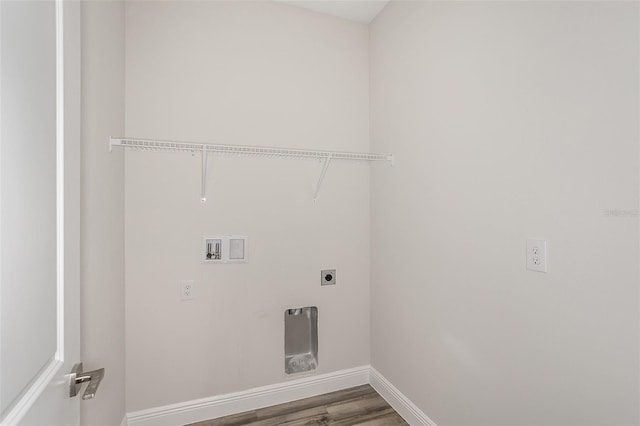 laundry area with laundry area, baseboards, wood finished floors, hookup for an electric dryer, and washer hookup