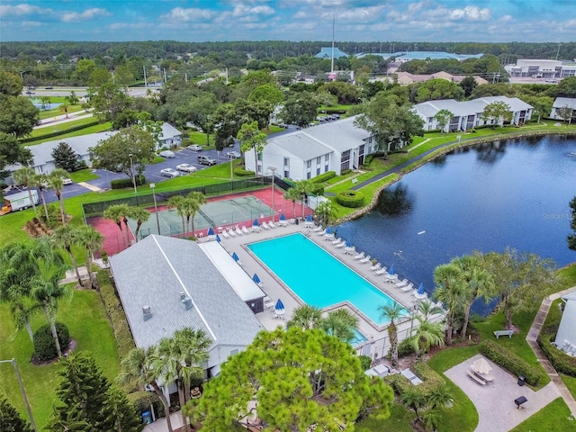 birds eye view of property with a water view