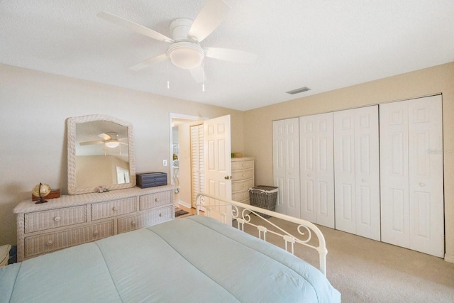 bedroom with carpet, a closet, and ceiling fan