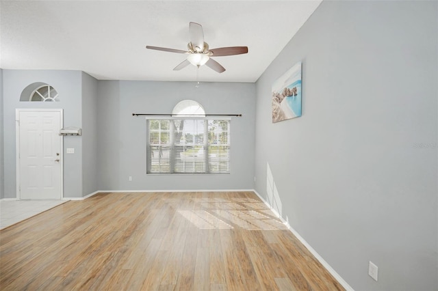 spare room with ceiling fan and light hardwood / wood-style floors