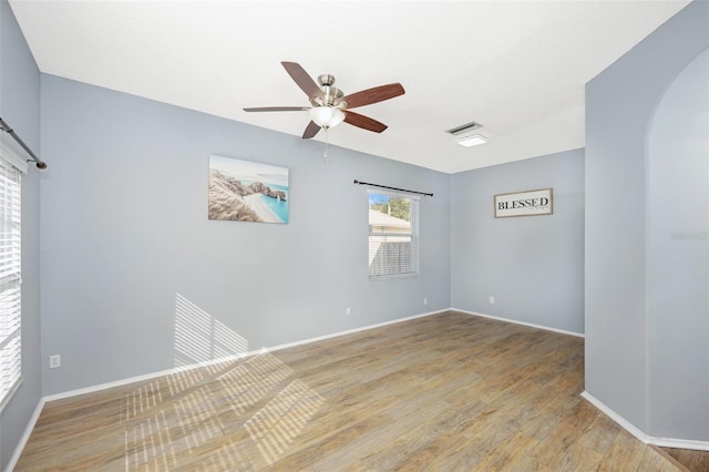 unfurnished room featuring ceiling fan and light hardwood / wood-style floors