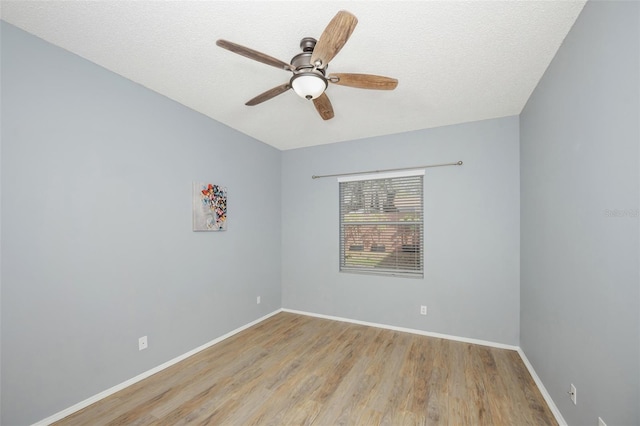 unfurnished room with a textured ceiling, ceiling fan, and light hardwood / wood-style flooring