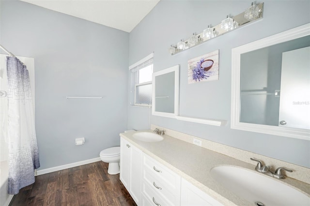 full bathroom with toilet, vanity, shower / bath combination with curtain, and hardwood / wood-style flooring