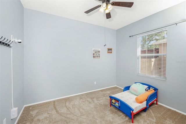 bedroom with ceiling fan and carpet flooring