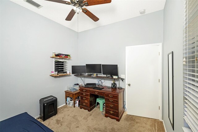 home office featuring ceiling fan and light colored carpet