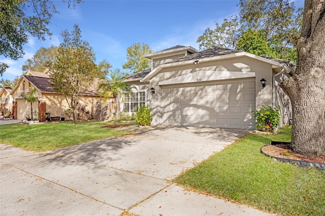 view of front facade featuring a front yard and a garage