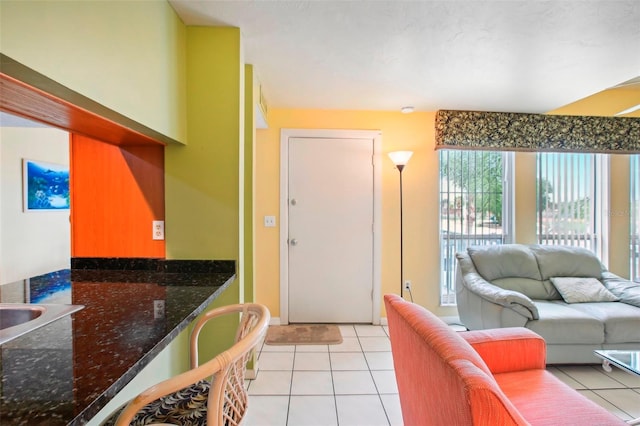 living room with light tile patterned floors