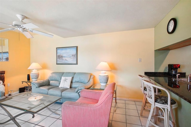 tiled living room with ceiling fan