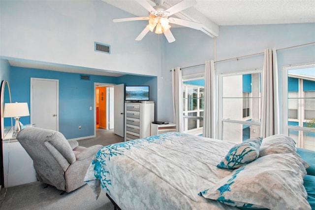 carpeted bedroom featuring vaulted ceiling, ceiling fan, and a textured ceiling