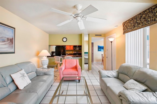 343 Rex Pl Unit F, Madeira Beach, FL 33708 - living room featuring light tile patterned flooring and ceiling fan