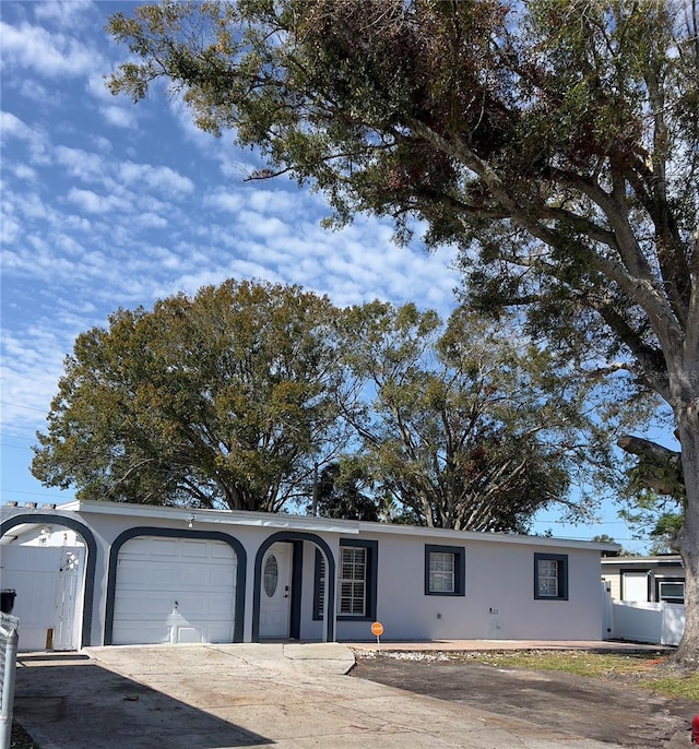 ranch-style home featuring a garage