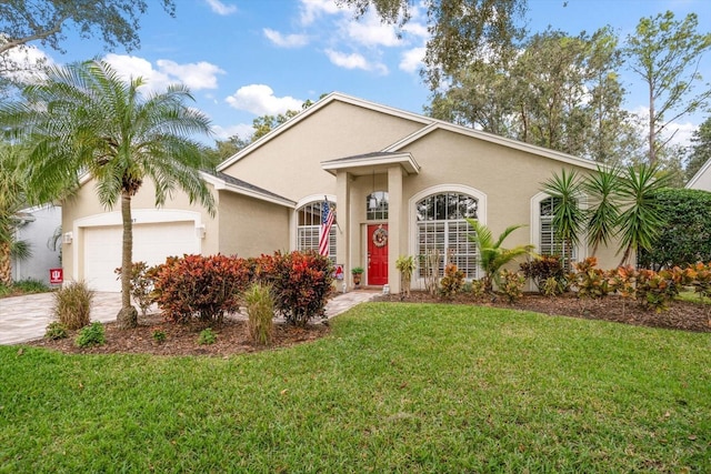 ranch-style home featuring a garage and a front yard